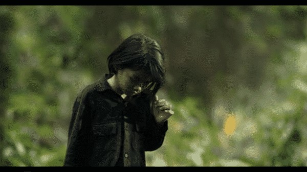 First They Killed My Father - LLoung walking through a minefield she created. While people die and explosions happen around her.