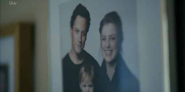 A picture of Andrew, his wife Mary, and their son.