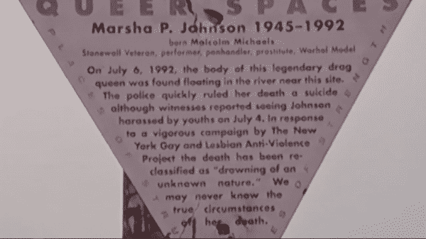 A "Queer Spaces" sign talking about how the Marsha's death and how the Anti-Violence Project got her death ruled a "drowning of an unknown nature" from a suicide.