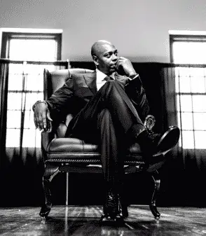 Dave Chappelle in a suit