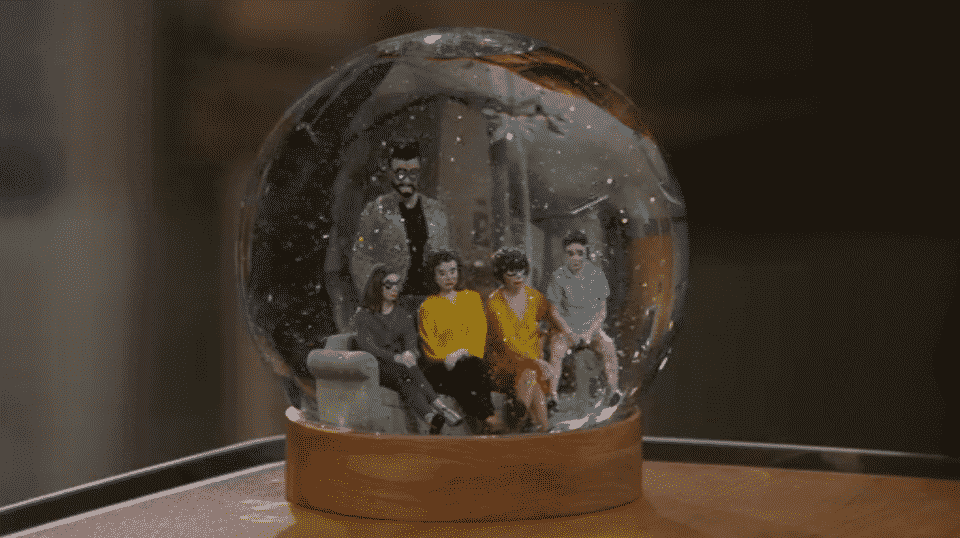Schneider's snow globe featuring him and Lydia's family.