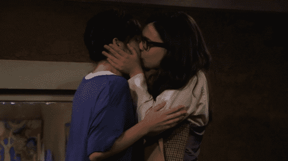 Syd and Elena kissing.