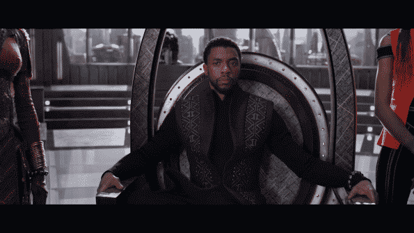 T'Challa sitting on his throne, within the council.