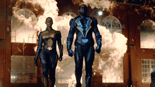 Thunder ans Black Lightning walking away from an explosion.