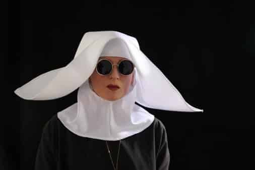 Big Mother in a nun's uniform.