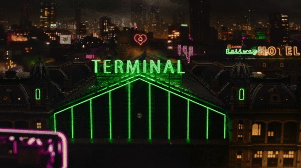 Terminal's movie title in neon lights.