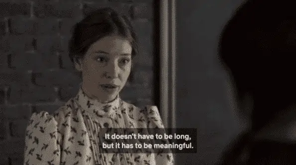 Miss Stacy noting how Anne should write her essay.