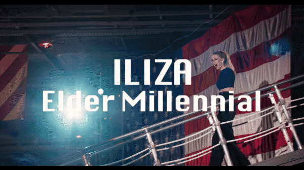 Iliza walking down with the title card overlayed