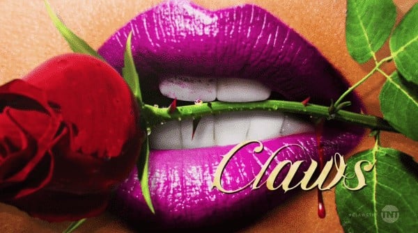 Title card for Claws featuring a rose between the lips.