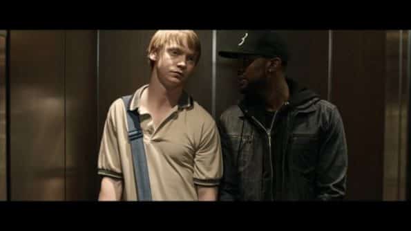 Adam (Calum Worthy) and Behn (Jackie Long) in a elevator.