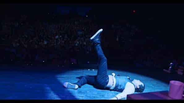 John Leguizamo on the floor, after dancing.