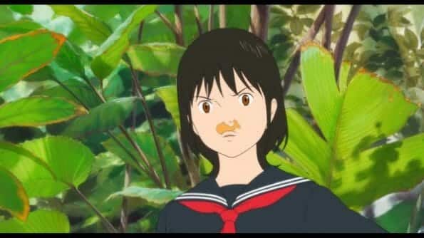 Mirai (Victoria Grace) with a animal cookie over her upper lip.