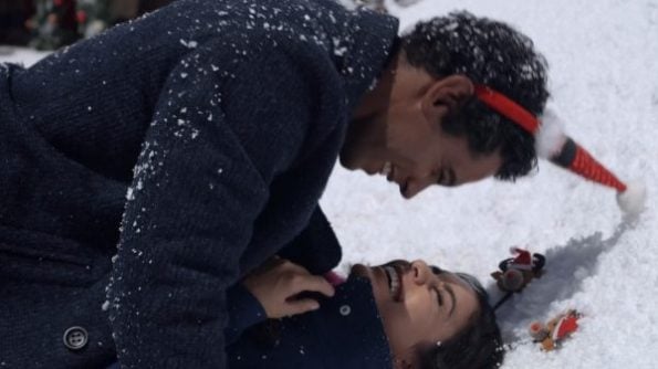 Kevin (Nick Sagar) and Margaret (Vanessa Hudgens) playing in the snow.