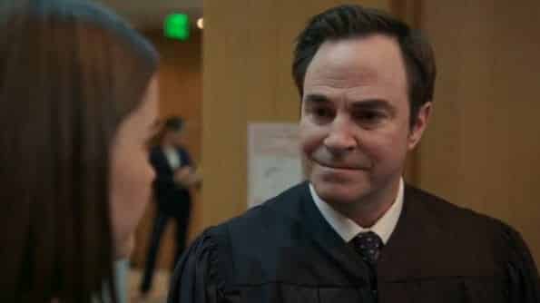 Judge Wilson (Roger Bart) talking to Callie about a case.