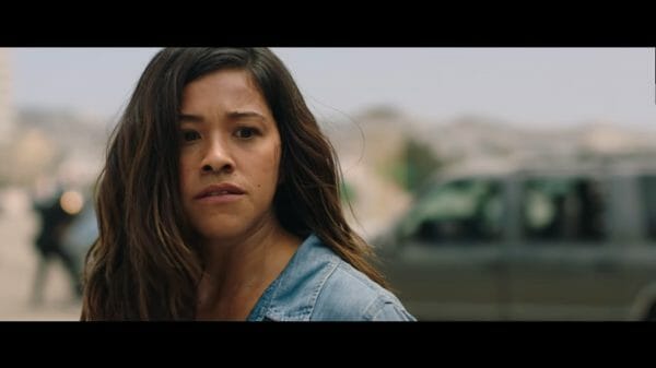 Gloria (Gina Rodriguez) contemplating whether to save Lino.