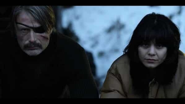 Duncan (Mads Mikkelsen) and Camille (Vanessa Hudgens) contemplating their next move.