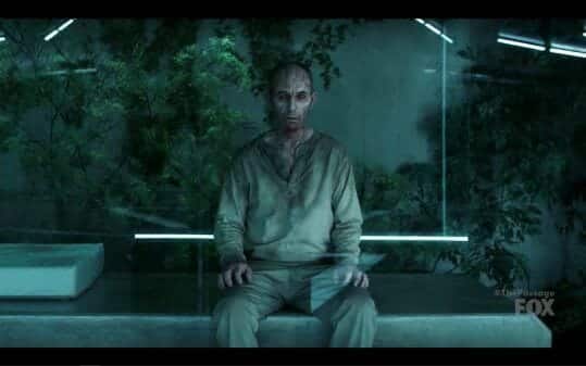 Tim (Jamie McShane) sitting, looking full on zombified, despite being a vampire.