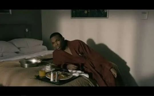 Orlando laying down in his robe, disappointed in Principal Cole.