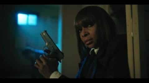 Cha-Cha (Mary J. Blige) waiting for Five to arrive to save Klaus.