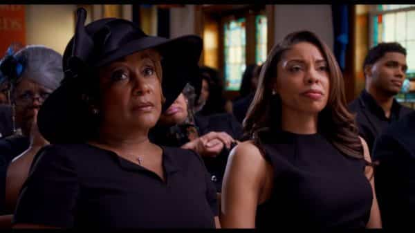 Vianne (Jen Harper) and Sylvia (Ciera Payton) during Anthony's funeral.