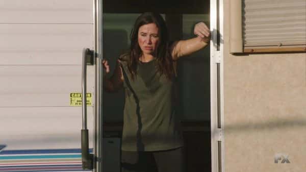 Sam getting out of her muggy trailer.