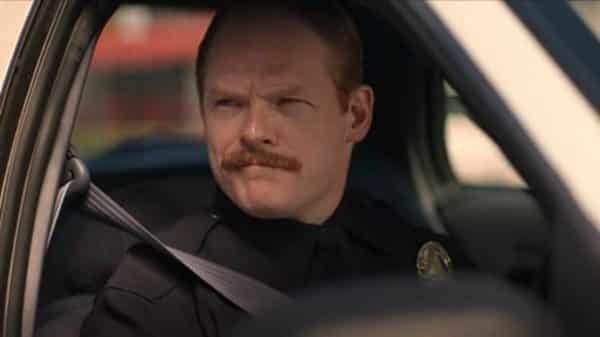 Officer Hamill (Brent Wezner) driving shotgun.