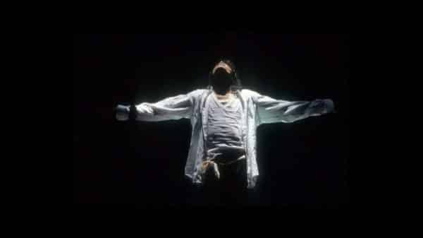 Michael Jackson with arms stretched out.