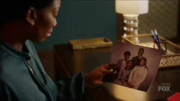 Cassie looking at a old family picture.