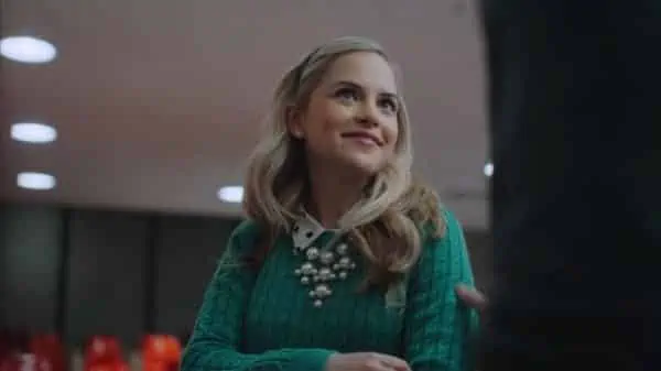 Kate (Stephanie Styles) smiling at Professor Charles.
