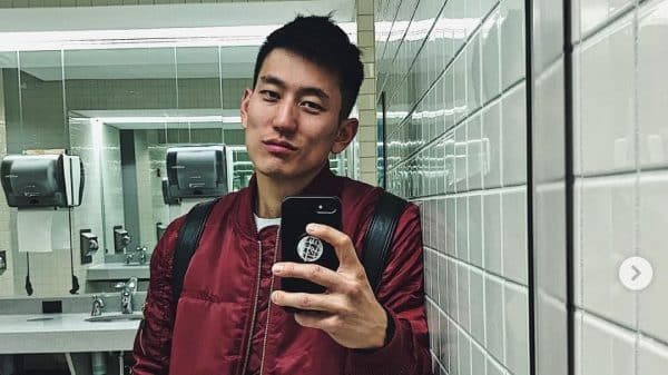 Image of Jake Choi taking a selfie in the bathroom.