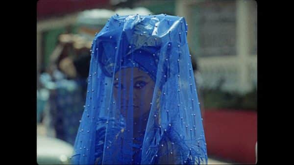 Kofi (Rihanna) in a blue veil towards the end of the movie.