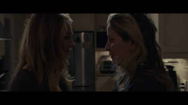 Kelly (Miranda Otto) and Lynn (Kate Trotter) talking to each other, figuring out if they should leave or not.