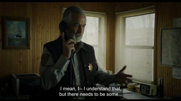 Ellis (David Strathairn) on the phone trying to figure out what is going on.