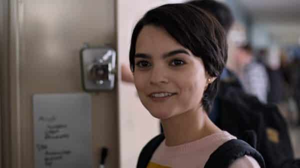 Elodie (Brianna Hildebrand) smiling towards Tabitha.