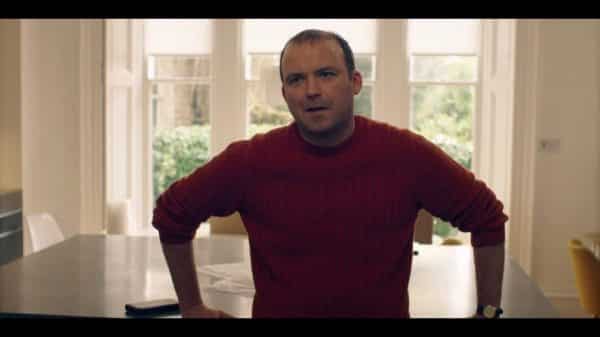 Stephen (Rory Kinnear) in a red sweater.