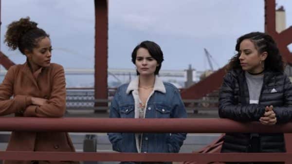 Tabitha, Elodie, and Moe on a bridge.