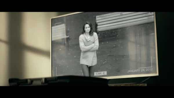Becca (Shantel VanSanten) on security cam footage.