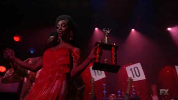 Candy accepting her trophy.