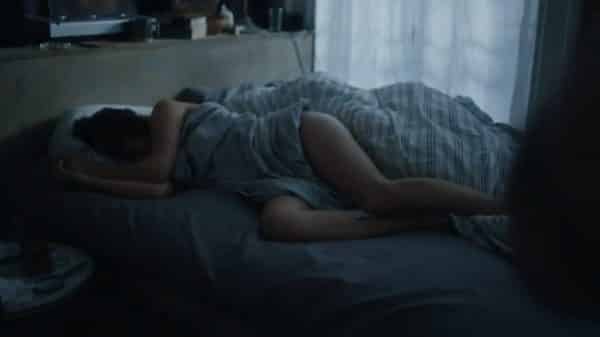 Rosalyn (Sadie Scott) sleeping in Jake's bed.