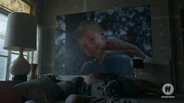 Dennis with a mosaic of his son on his wall.