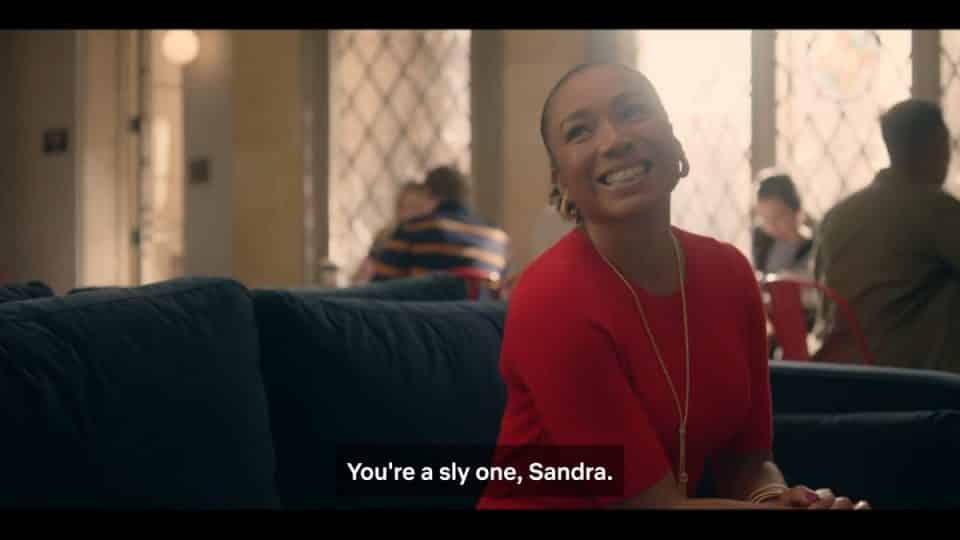 Sandra (Eva La Dare) smiling at Dean Fairbanks.