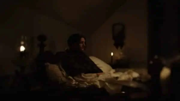 Marilla, Michael and Matthew's Mother (Delphine Roussel) sitting depressed and silent, in bed.