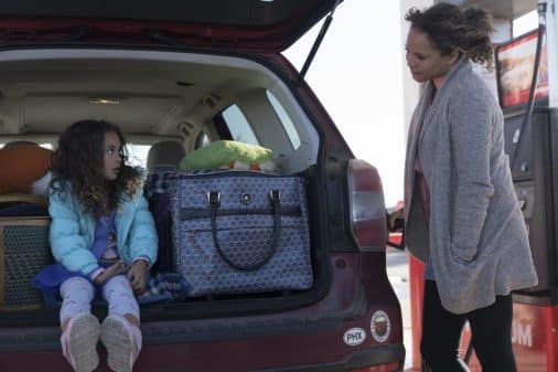 Clara (Apollonia Pratt) and Katrina (Carmen Ejogo) at a gas station.