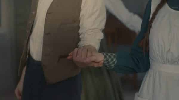 Gilbet and Anne holding hands