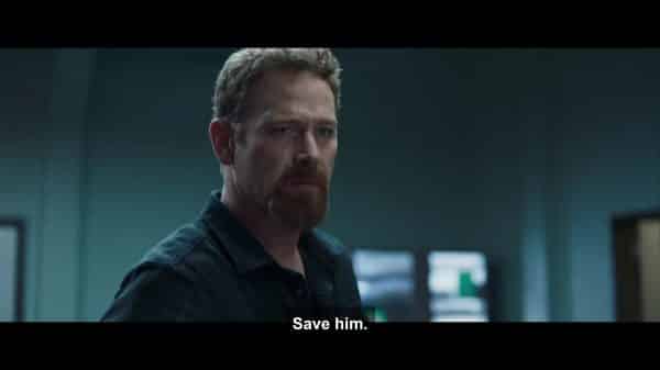 Paul (Max Martini) asking Dr. Horn to save Eli.