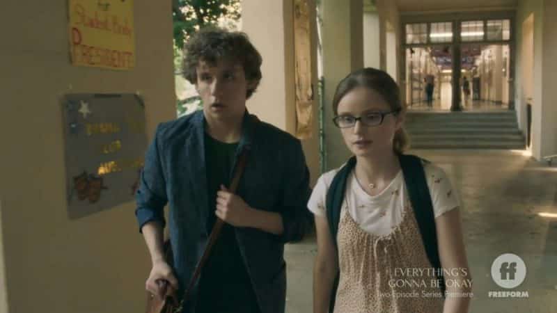 Jeremy (Carsen Warner) and Matilda walking down a hallway.