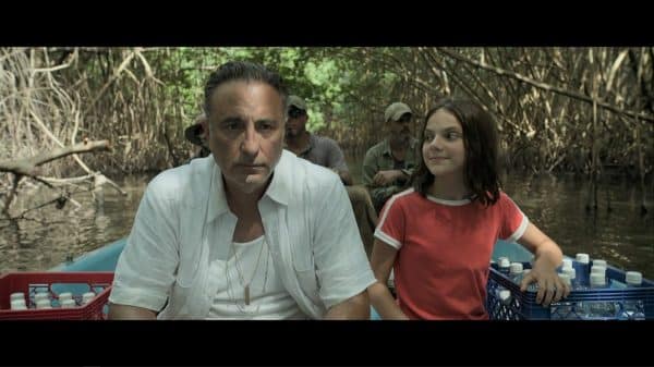 Rafa (Andy Garcia) and Ana (Dafne Keen) on a river.