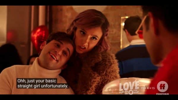 Sam (Jake Borelli) and Stasia (Britt Baron) at a party as Stasia laments being straight.