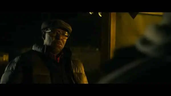 Courtney B. Vance as Louis talking to someone at night.