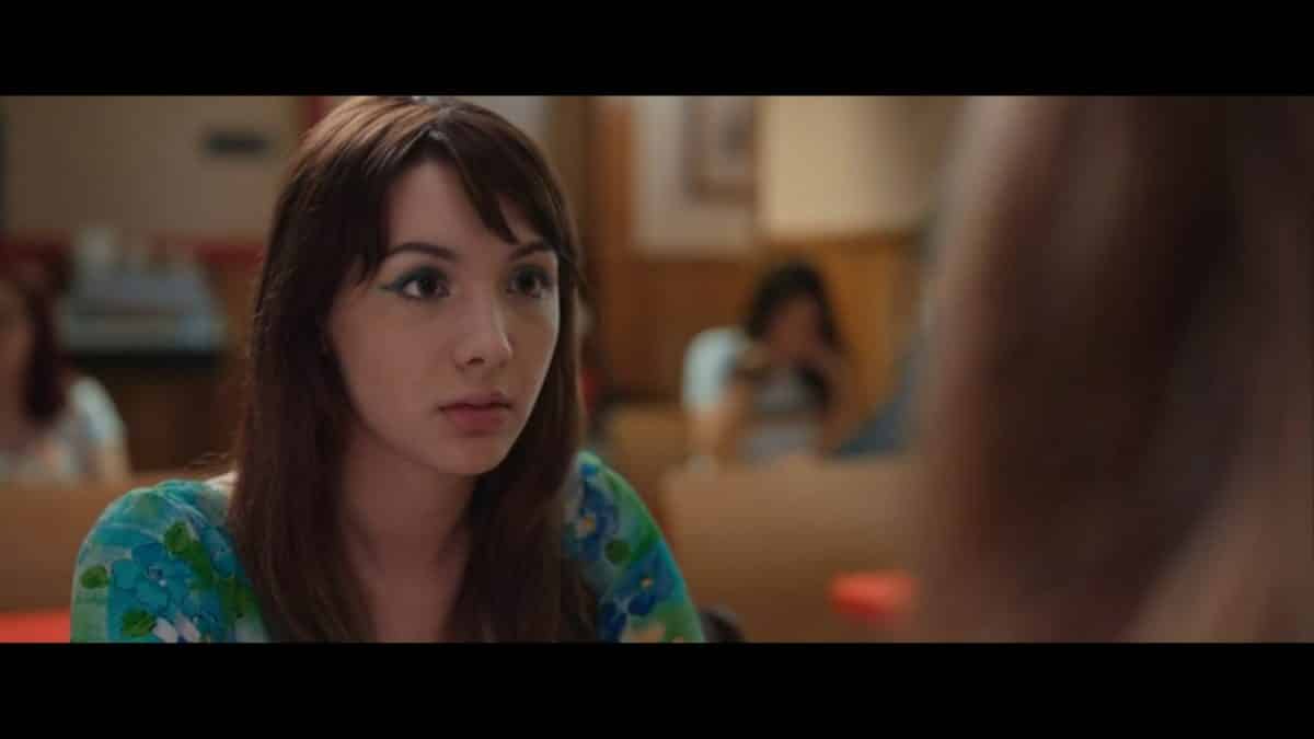 Hannah Marks as April with her eye-liner popping.